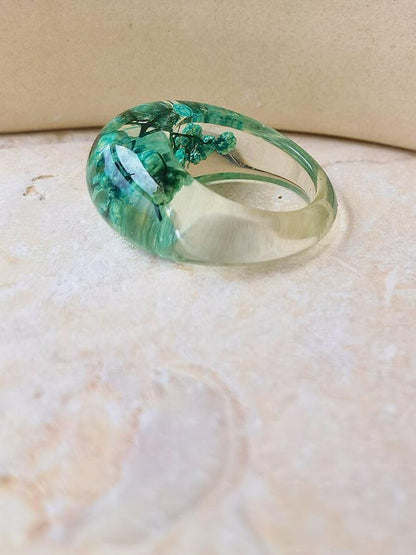 Dried flower resin ring with green flowers