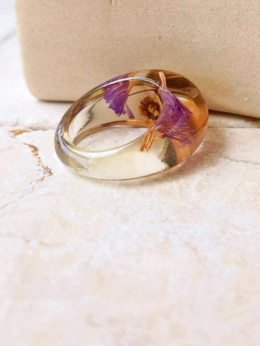 Dried flower resin ring with purple flowers