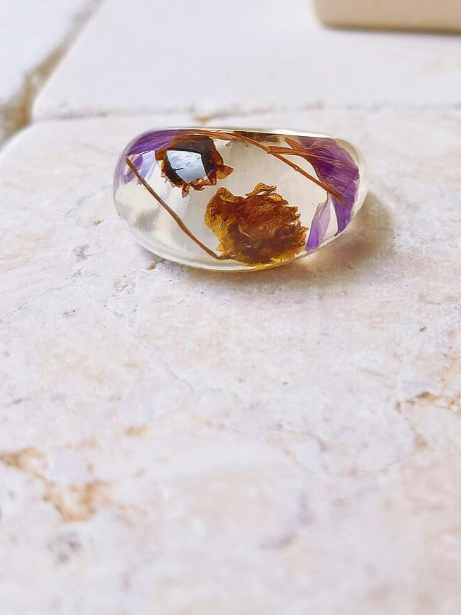 Dried flower resin ring with purple flowers